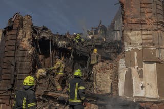 Ukrainian rescuers work at the site of heavily damaged buildings following a Russian air attack in Dnipro, on 16 April 2026, amid the Russian invasion of Ukraine